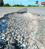 The potholes on the small stretch of East Second Street North near Casey’s General Store have grown enormous and are difficult to dodge. 

TRIBUNE PHOTO