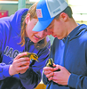 Kasen Mosloski, left, and Tavin Janssen hold their baby “pocket ducks” while waiting for students to arrive during the campus FFA Ag Day.

TRIBUNE PHOTOS